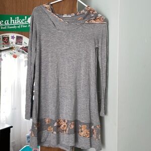 Grey dress with flower hood .